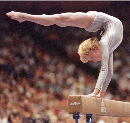 Kristie Phillips performing on the balance beam in competition